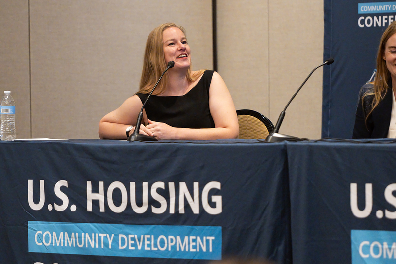Alina Carnahan speaking on housing policy at the 2026 conference